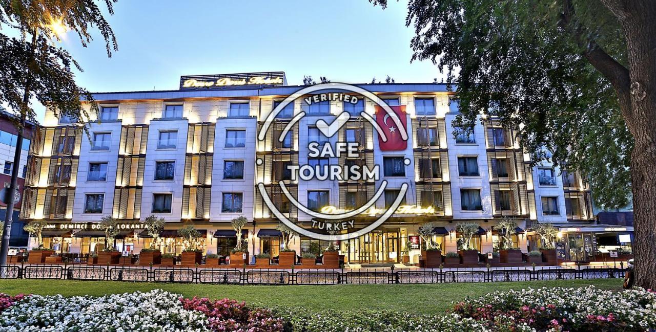 Dosso Dossi Hotels & Spa Downtown Istanbul Ngoại thất bức ảnh The photo shows a modern hotel building, prominently featuring a well-lit façade. In front of the hotel, there are landscaped gardens with colorful flowers. Overlaying the image is a "Verified Safe Tourism" badge, indicating that the location meets c