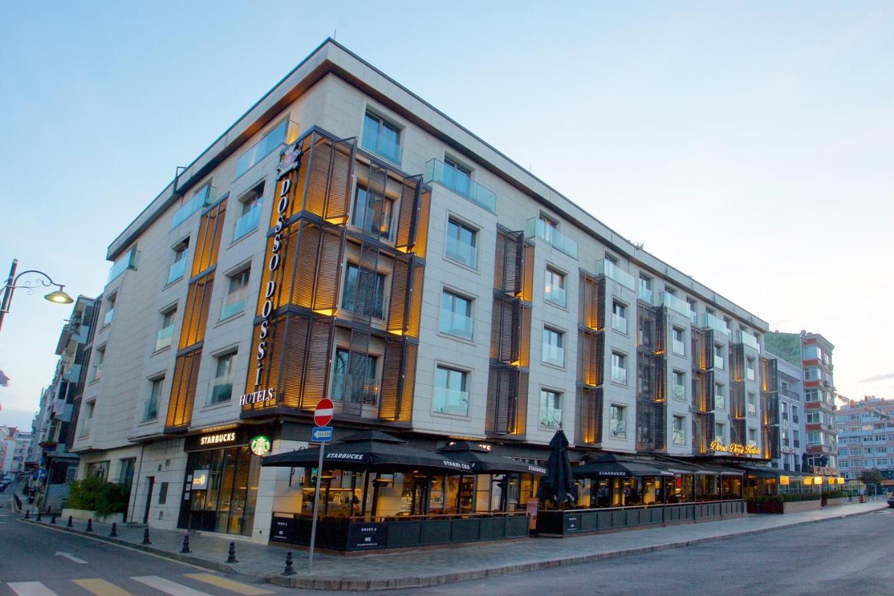 Dosso Dossi Hotels & Spa Downtown Istanbul Ngoại thất bức ảnh The photo shows a modern building that appears to be a hotel. It has a contemporary architectural design with a mix of light-colored walls and wooden accents. The structure is four stories high and features large windows that allow for plenty of natu